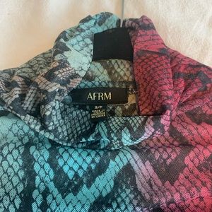 Light and sheer multi color snakeskin turtle neck